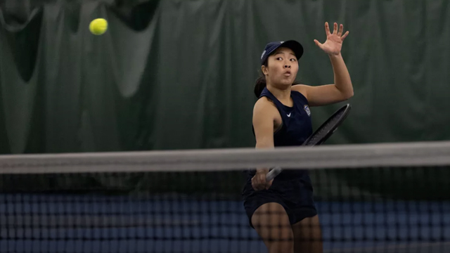 Nana Vang ’28 playing tennis.