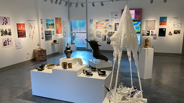 The Fouts gallery space displaying multiple pieces of student artwork.