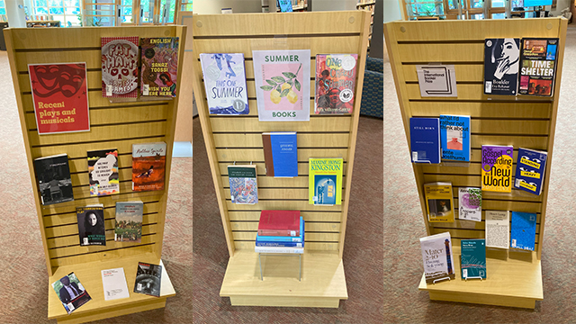 Three panel displays of books.