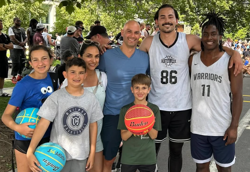 John Lamanna, former players, and young kids at an outdoor event