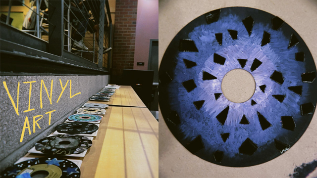 Small vinyl records with artwork painted onto them.