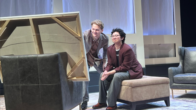 Rehearsal photo from “ART”: Two actors looking at a painting on a canvas which is not visible to the audience.