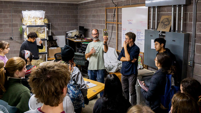  A group of Whitman Environmental Studies students gathered around tour guide at Chese Farm.