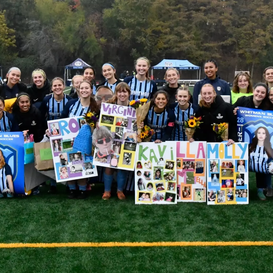 Women's soccer celebrating on the field