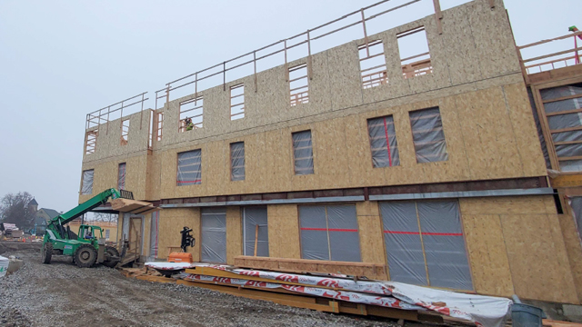 A construction photo of the future Harvey Hall, taken on an overcast day.