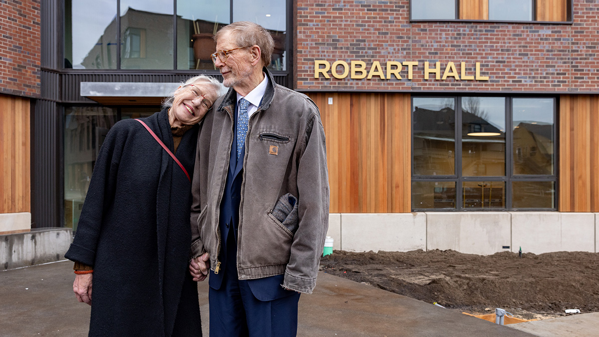 James Robart ’69 (right) and his wife, Mari Jalbing (left), stand outside of Robart Hall.