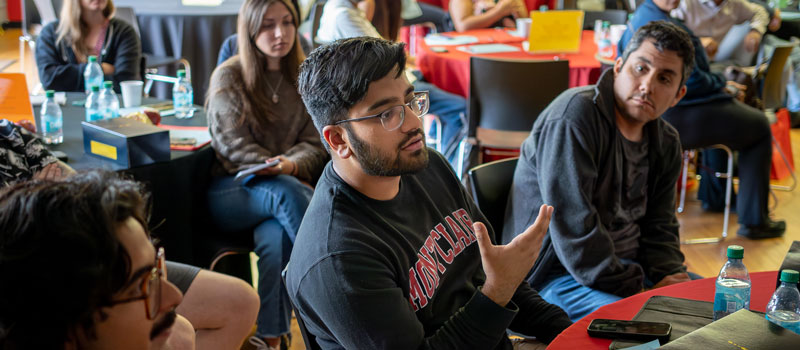 Student talking in crowded room