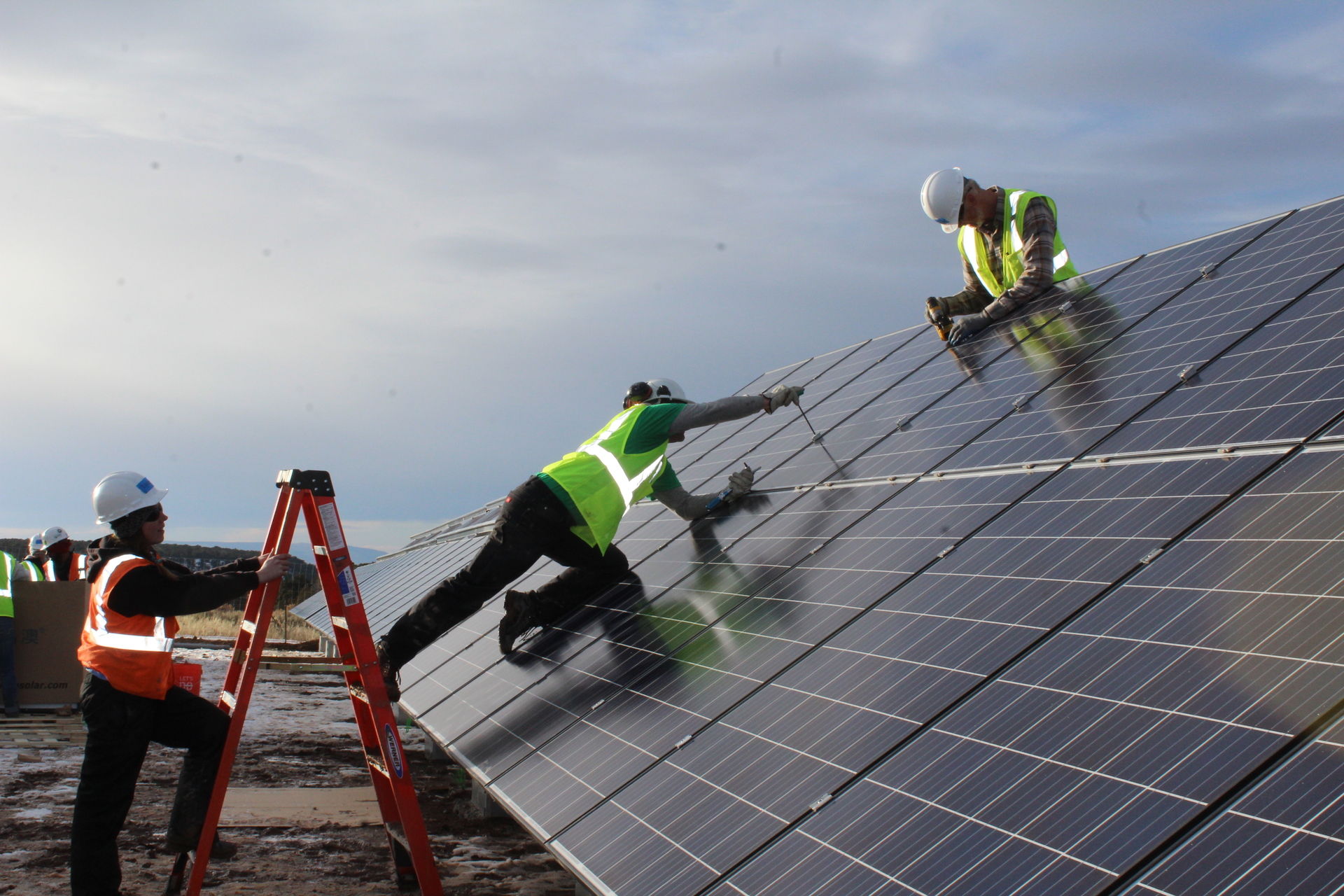Photo of engineers working on a solar panel