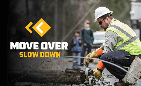 Move over, slow down. - Photo: Two kids watch lineman repair fallen powerline.