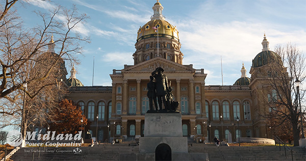 Capitol building with statue out front on winter day