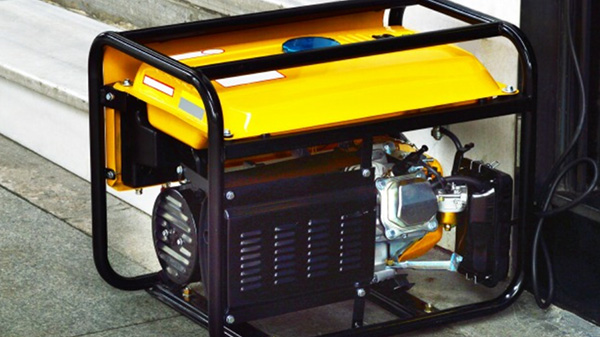 Black and yellow generator on floor.