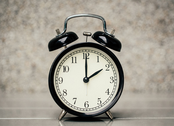 Black analog clock at 2 o'clock