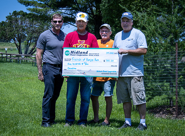 Midland workers presenting check to Friends of Popejoy Park.