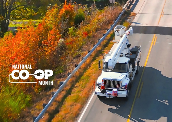 National Co-op Month; Image: Bucket truck driving down the road.
