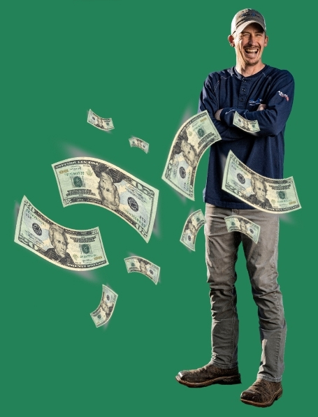 Smiling Connect2First employee surrounded with falling $20 bill