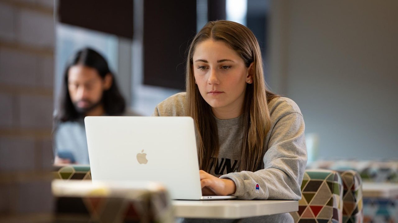 UC student studying on a laptop 
