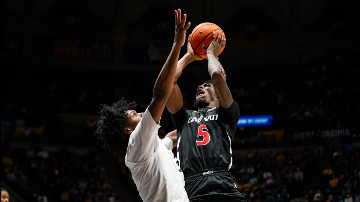 UC men's basketball player taking a shot