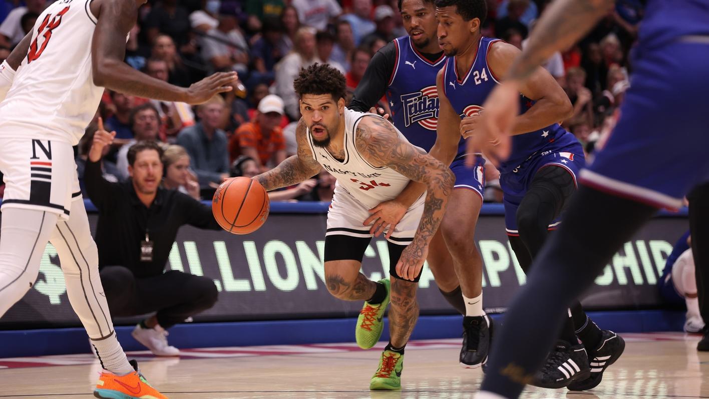 former UC basketball player dribbling down court