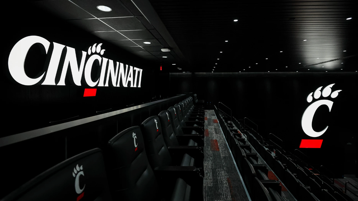 UC Athletics auditorium with C-paw logo