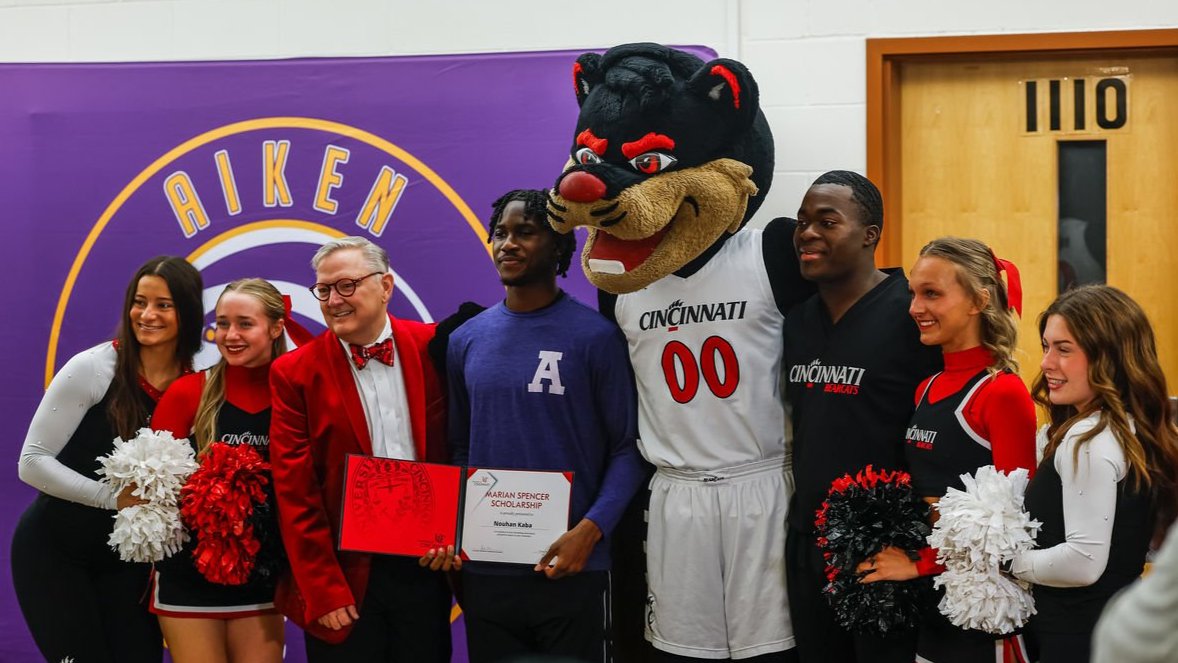 Students posing with Bearcat mascot on Decision Day