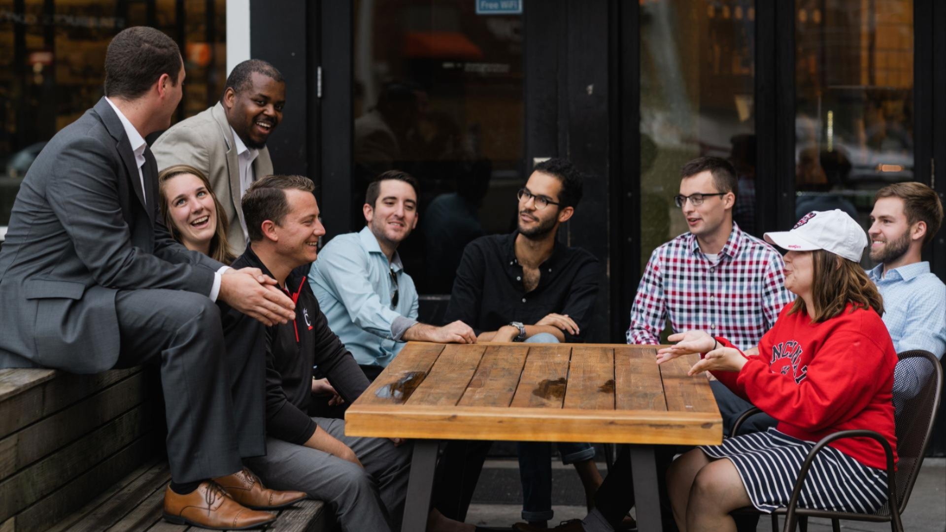 group of alumni sitting at a table networking