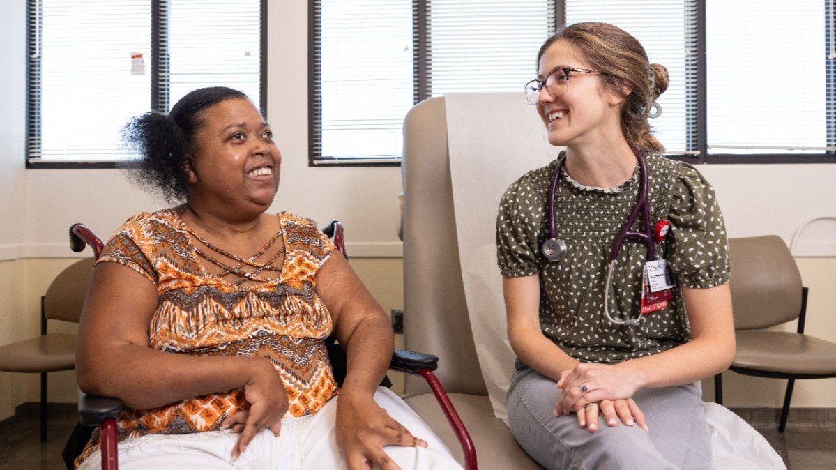 Nurse Practitioner Catriona Shaughnessy, right, with a patient at the Freeman Center