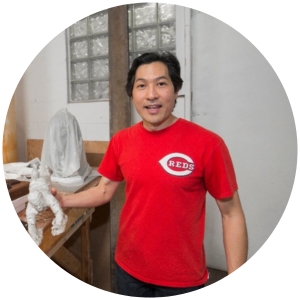 Tom Tsuchiya working on statue of Pete Rose in his art studio