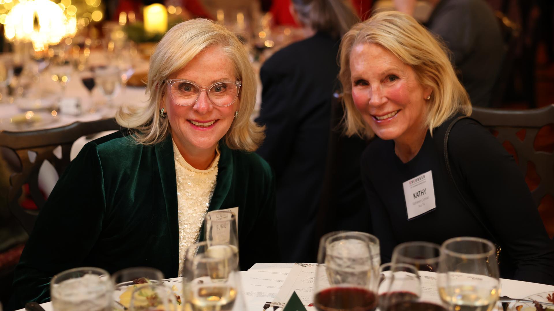 Two alumni enjoying wine at an UnCorked event