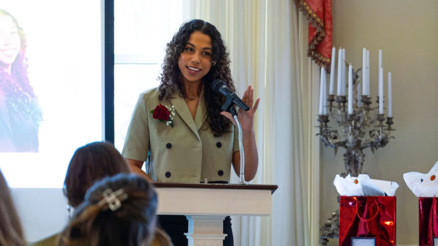 Taylor Allgood accepts a University of Cincinnati award