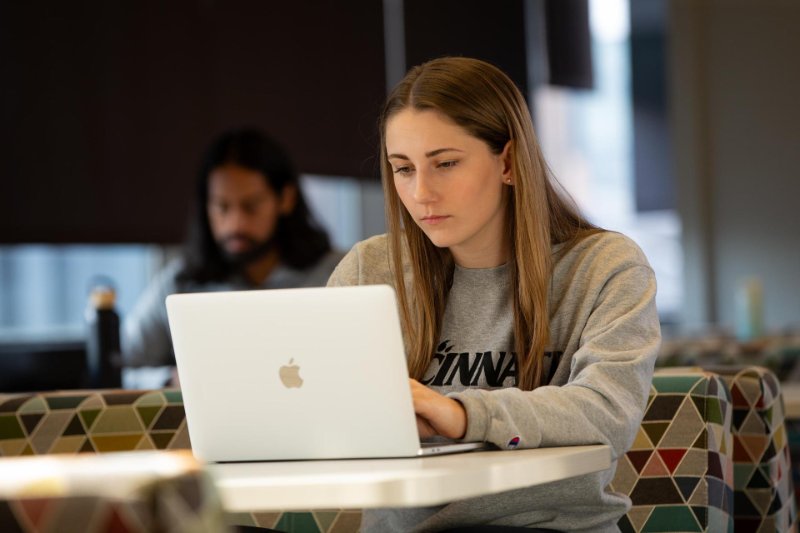 Woman using a laptop in a study area