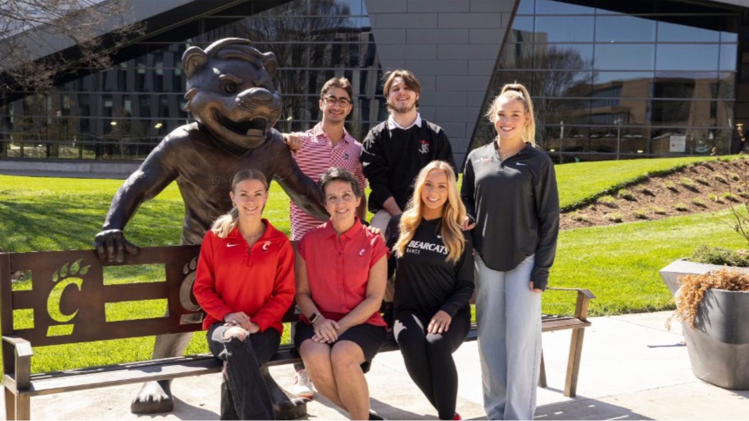 Kim Dobbs sitting with students