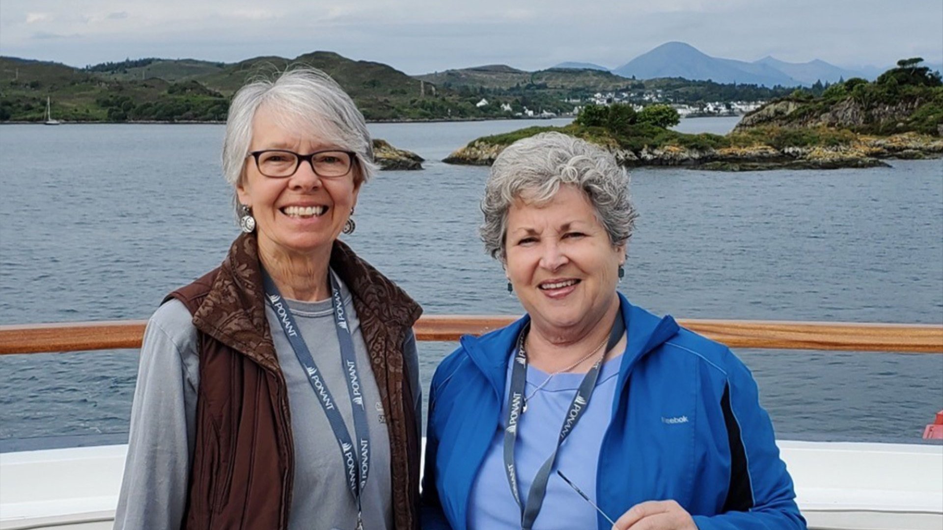 UCAA Alumni Travel Program participants posing on a boat
