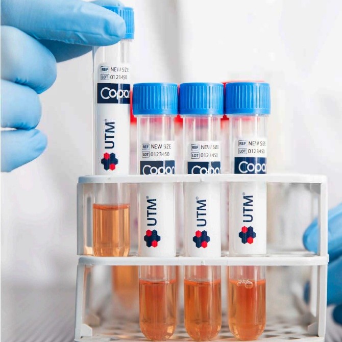 a person holding a tube with a yellow object in it