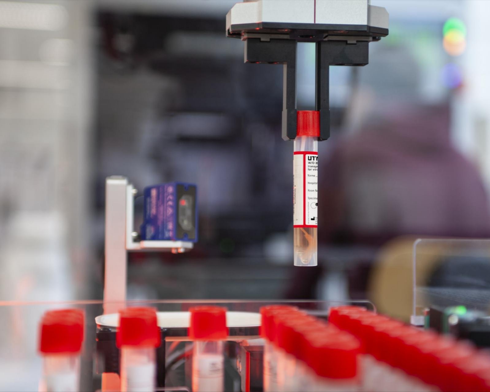 a person holding a tube with a yellow object in it