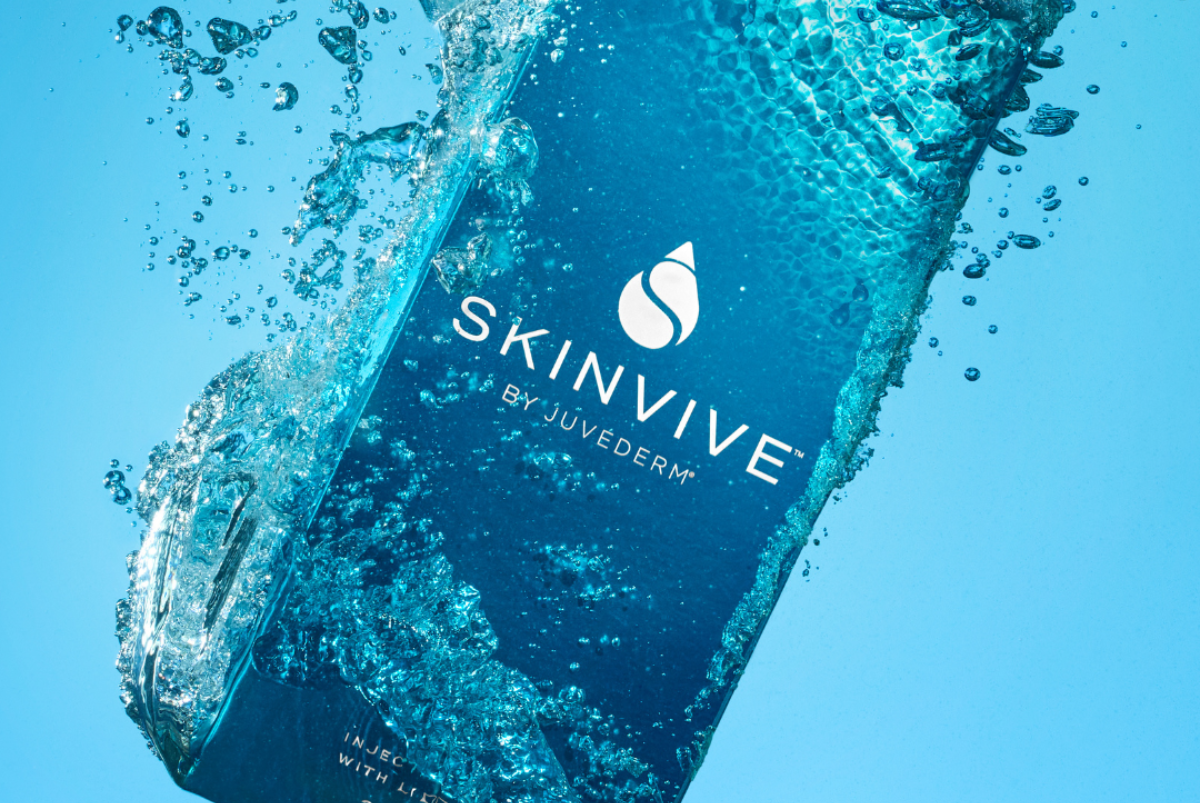 a dropper bottle of suntan lotion