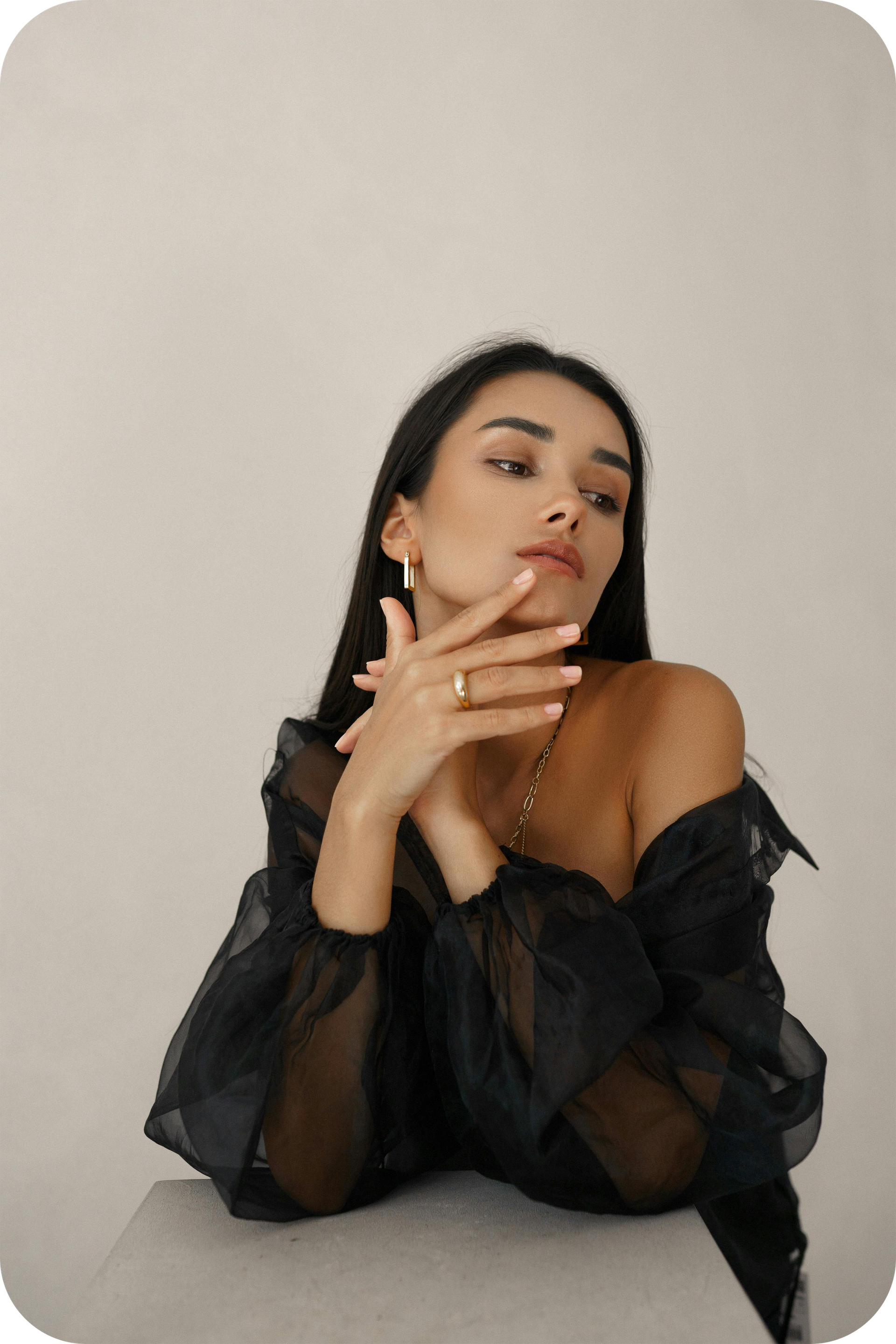 a woman with her arms raised and her eyes closed