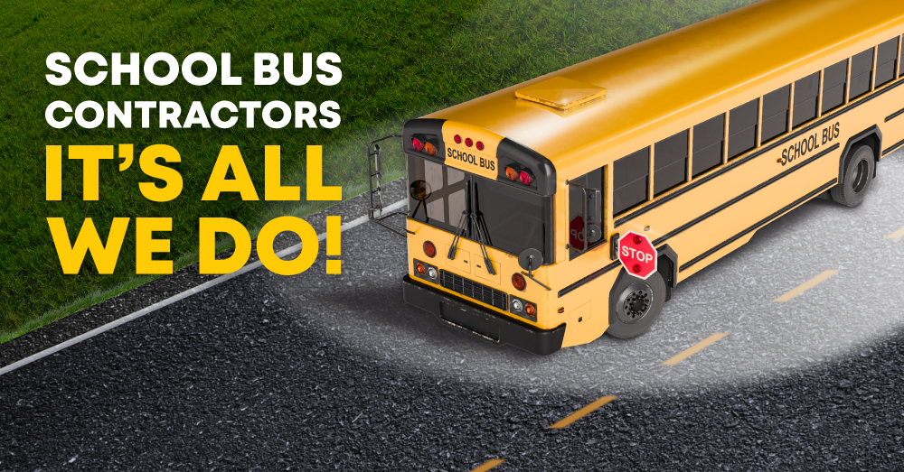 School bus under spotlight with text: School Bus Contractors – It’s All We Do!
