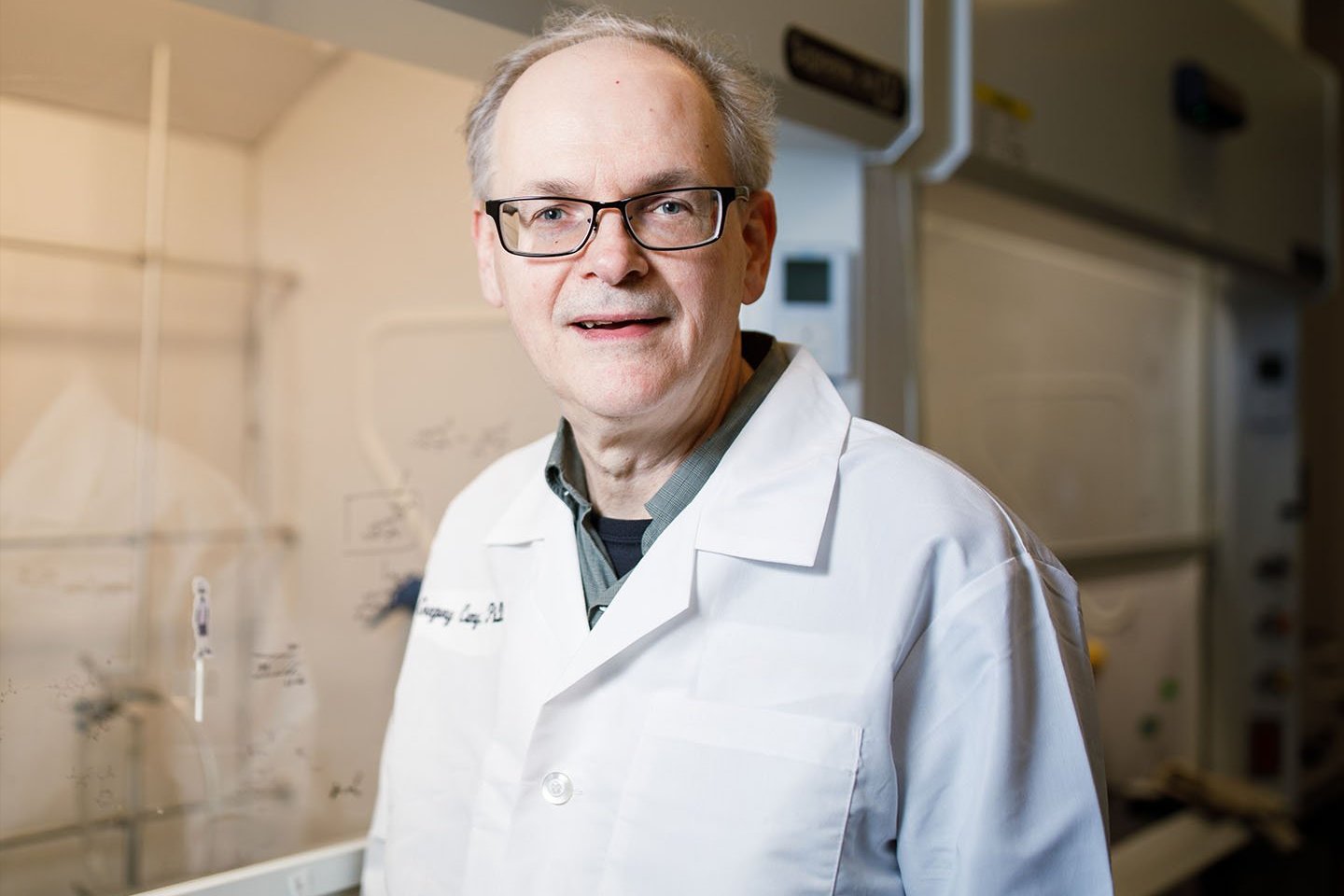 Image of Professor Gregory Cuny smiling in a laboratory.