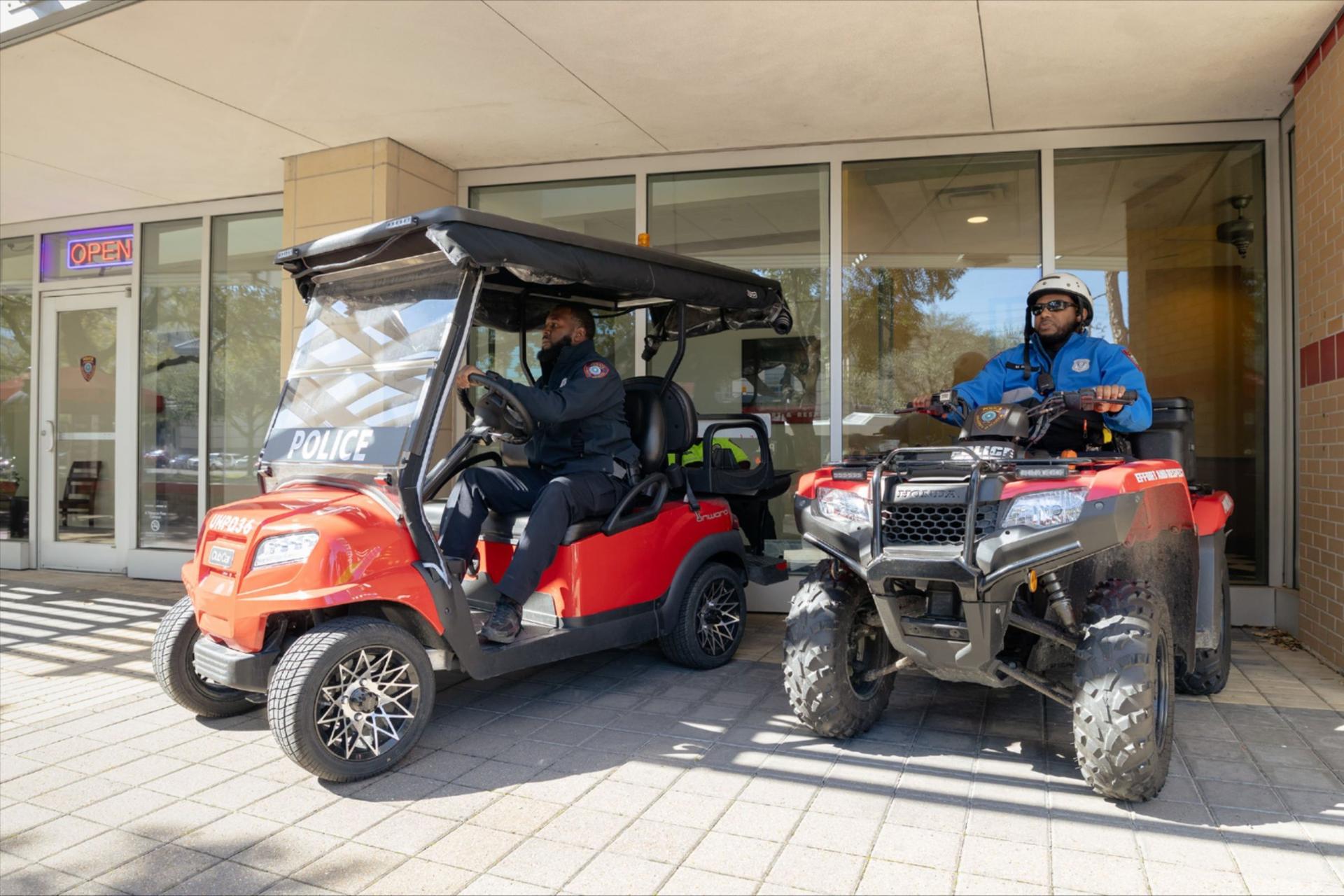 UH police on golf carts and ATVs posing outside of the new substation. 
