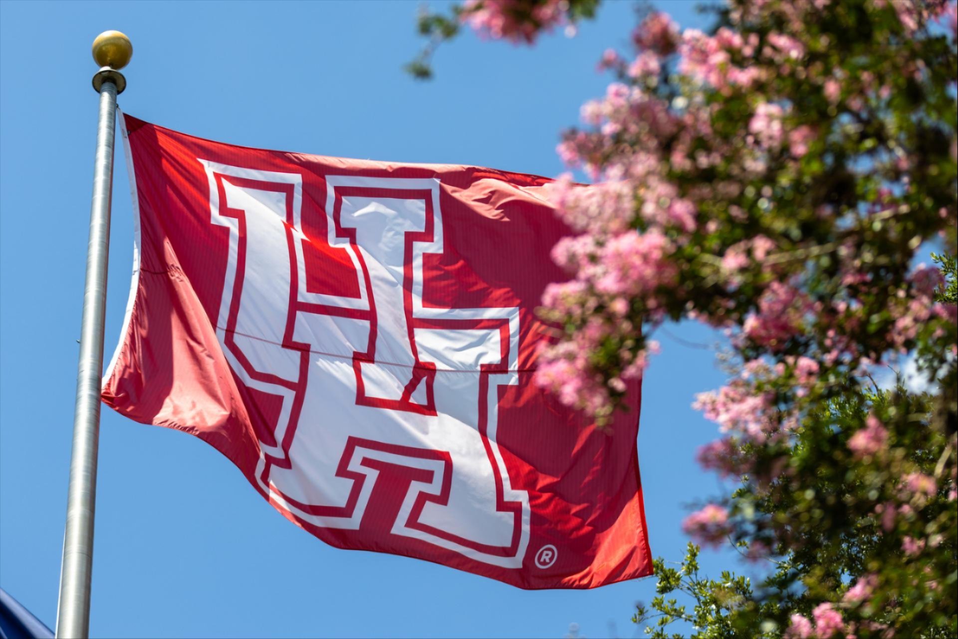 A UH flag blowing in the wind. 