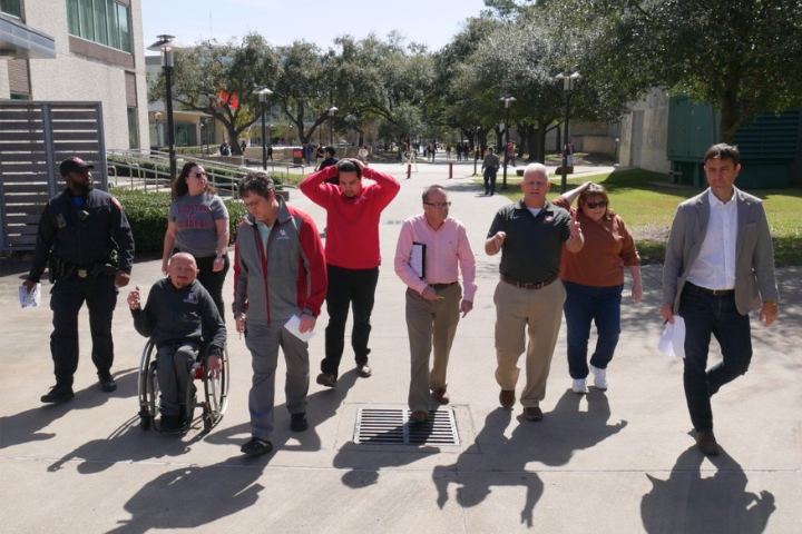 members of the UH community walking around campus 