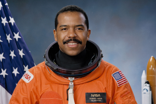 UH alumnus, Dr. Bernard Harris  dressed in an astronaut suit