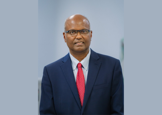 Image of engineering professor Venkat Selvamanickam smiling.