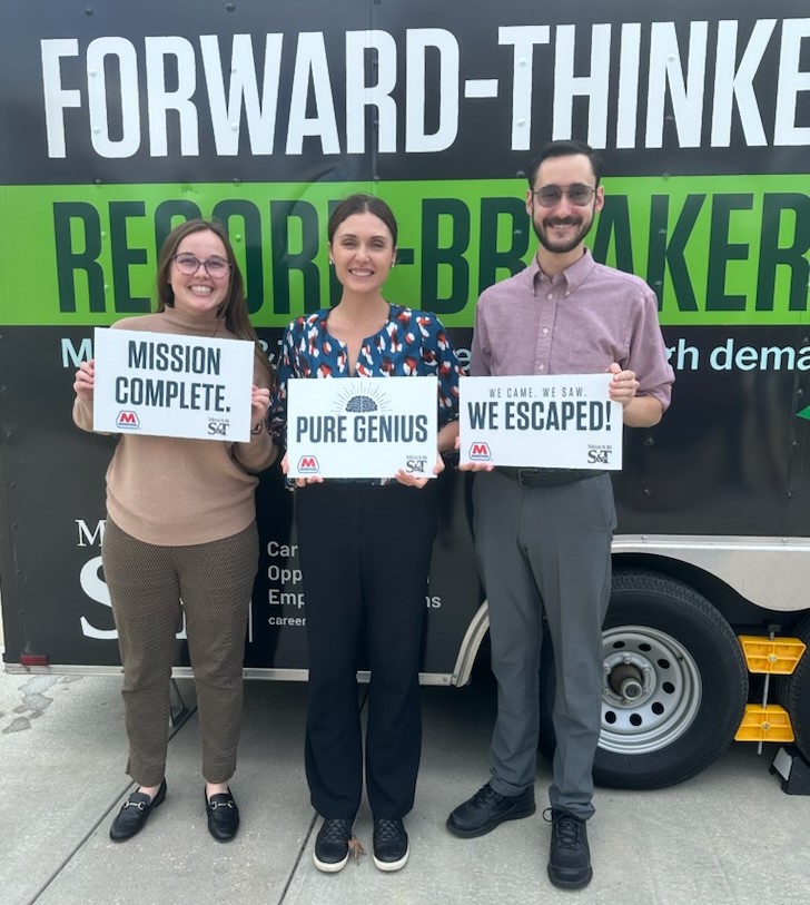 Stephanie Murray-Miller, Kayla Burns, and Derek Zboran successfully escape the COER Mobile Escape Room