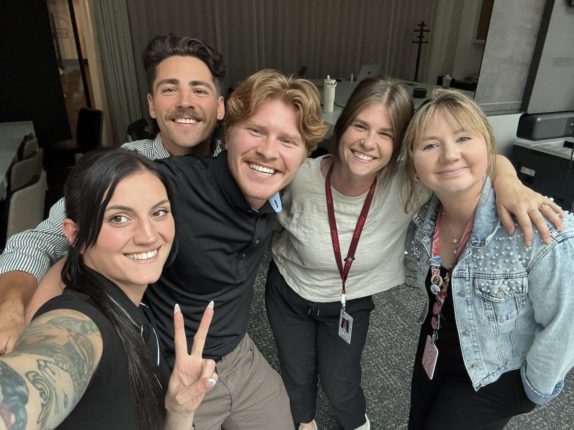 Sam Wright and his coworkers from Rocket pose for a selfie.