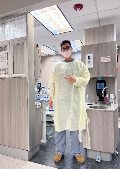 Osil Martinez standing at a dental clinic. 