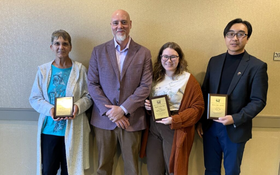 Awardees with their plaques