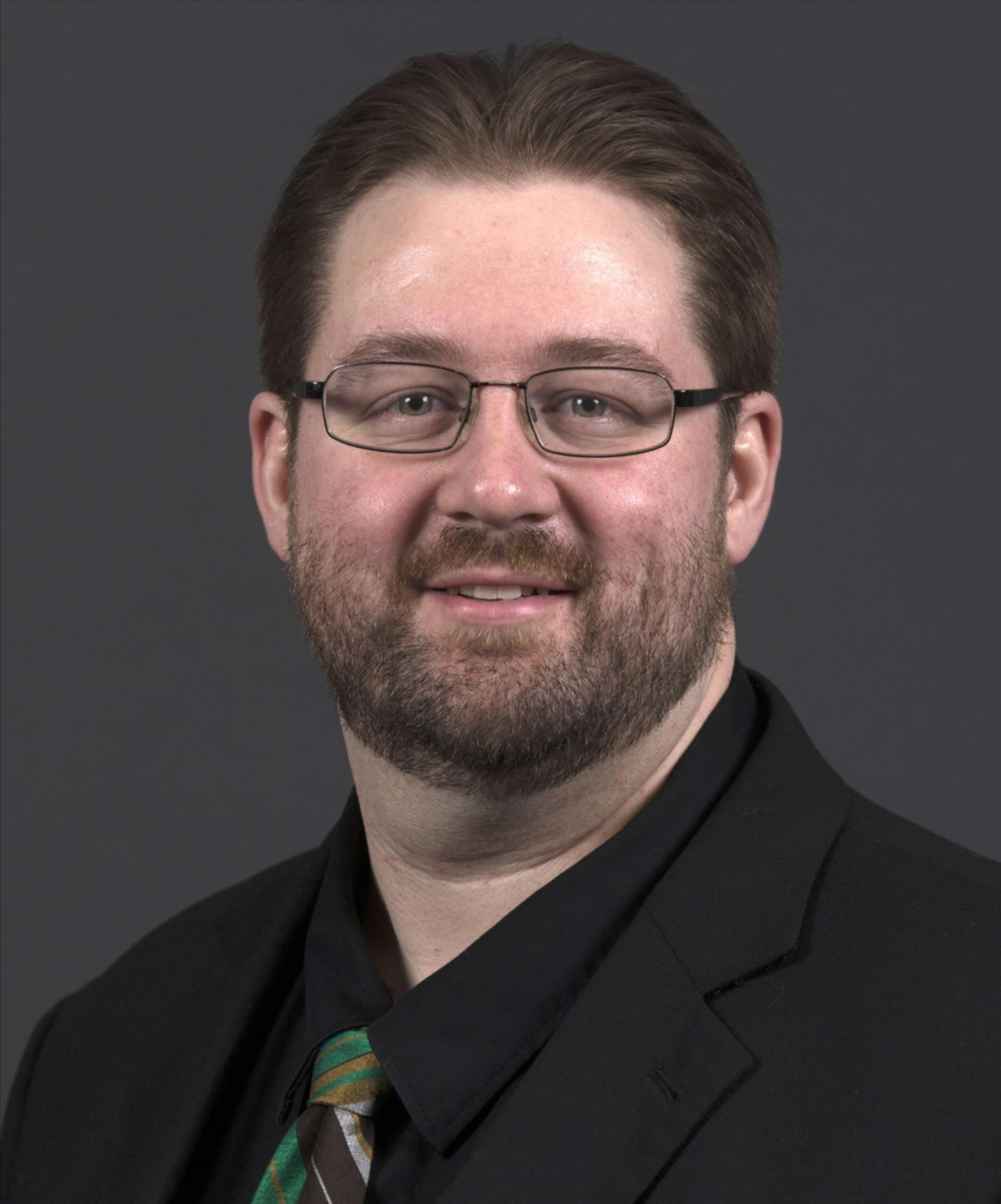 Headshot of Dr. Joshua Schlegel.