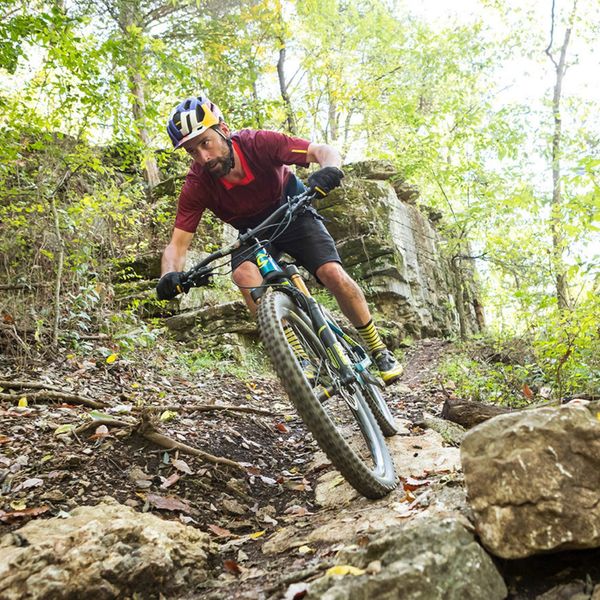 a man riding a bike on a trail