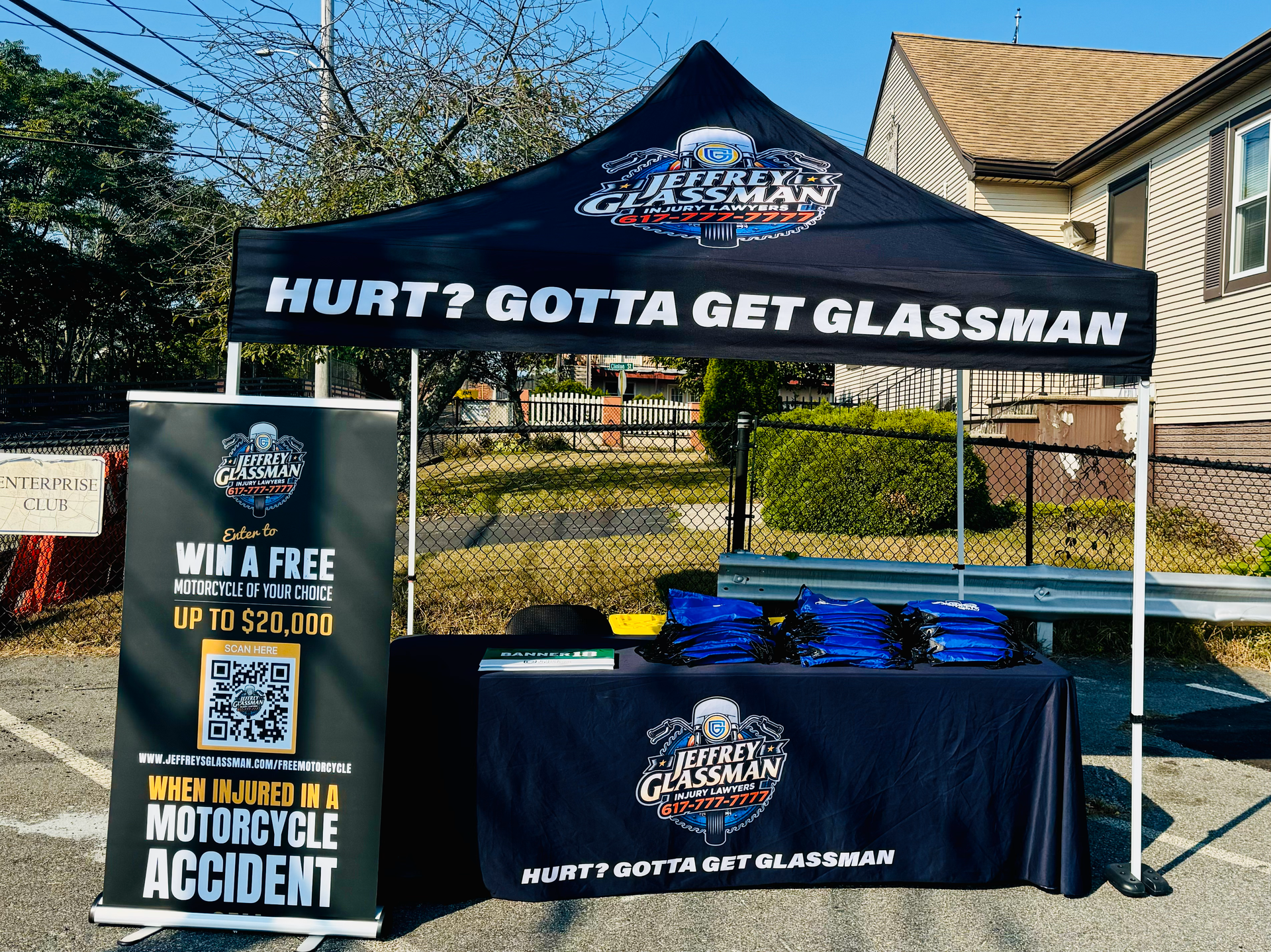 a tent with a table and a sign